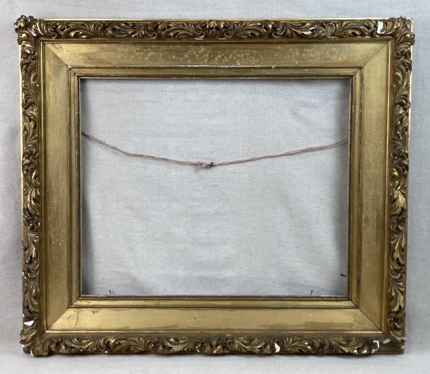 19th Century Baroque Style Gilt Frame: Gilt frame with decorative molding in a classic Baroque vegetal pattern, likely dating to the 19th century. Overall dimensions measure approximately 26 7/8â€³ H x