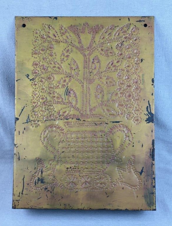 Punched Tin Rolling Pin Rack: Yellow painted punched tin rack designed to hold rolling pins, decorated with a basket and floral motif in a pierced pattern, presenting a classic country kitchen form. Measures approximately 22