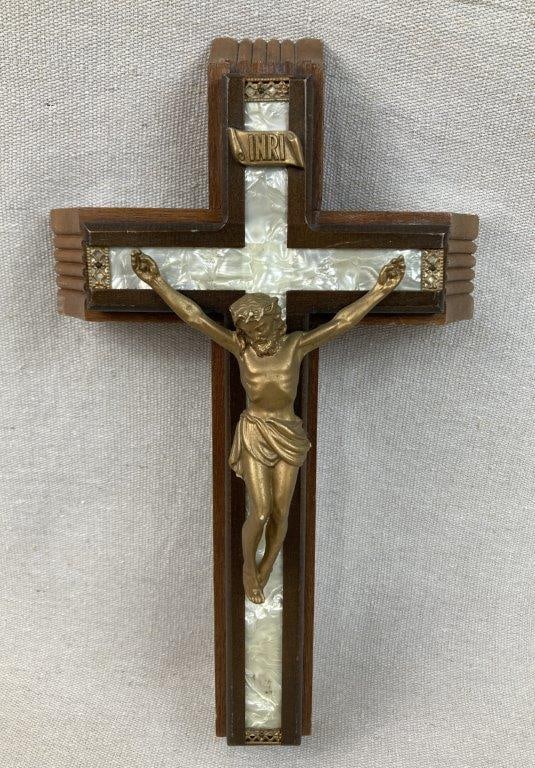 Crucifix with Faux Mother-of-Pearl Inlay: Wall crucifix constructed from a variety of woods with faux mother-of-pearl inlay, centered by a figure of Christ with gilt finish, presenting a traditional devotional form. Measures approximately 30