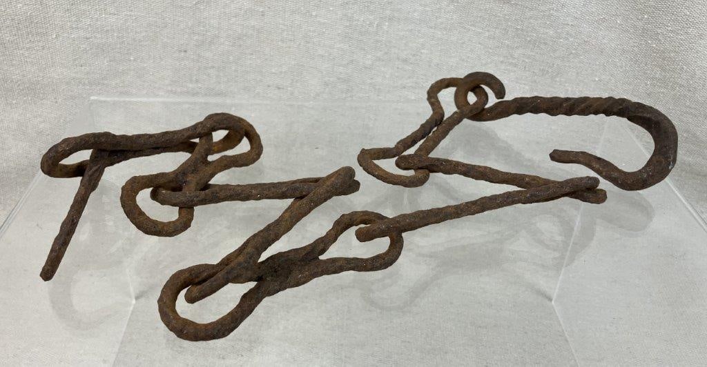 Wrought Iron Meat Hooks: Antique chain with hooks constructed of hand-wrought iron, traditional utilitarian form used for hanging meat. Measures approximately 31â€³ in length. General wear with some spotting