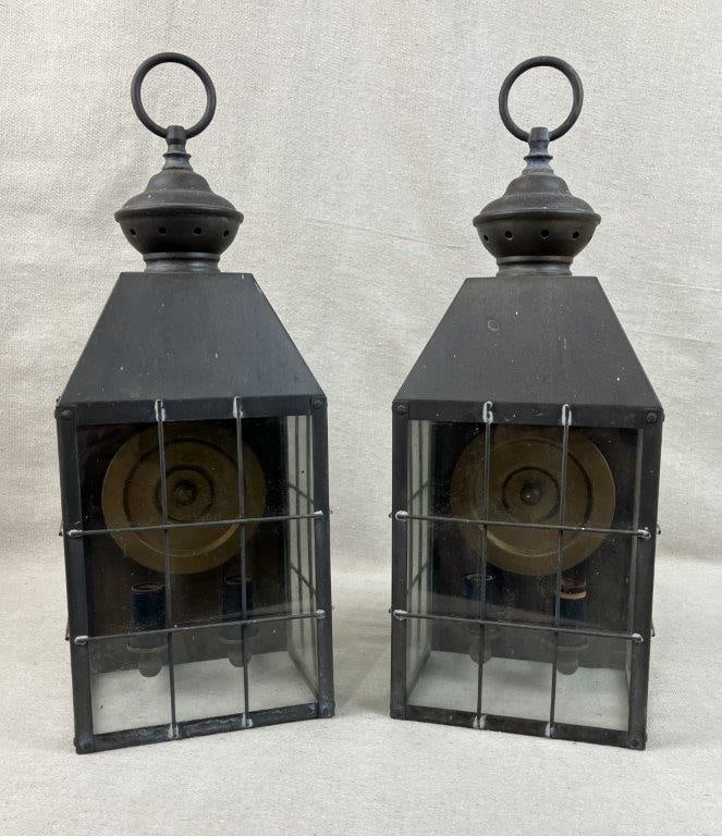 Pair of Brushed Metal Lanterns: Glass-paneled lanterns with brushed metal frames, classic rectangular form with loop handles. Each measures approximately 16 1/2â€³ H x 6 1/8â€³ W x 6