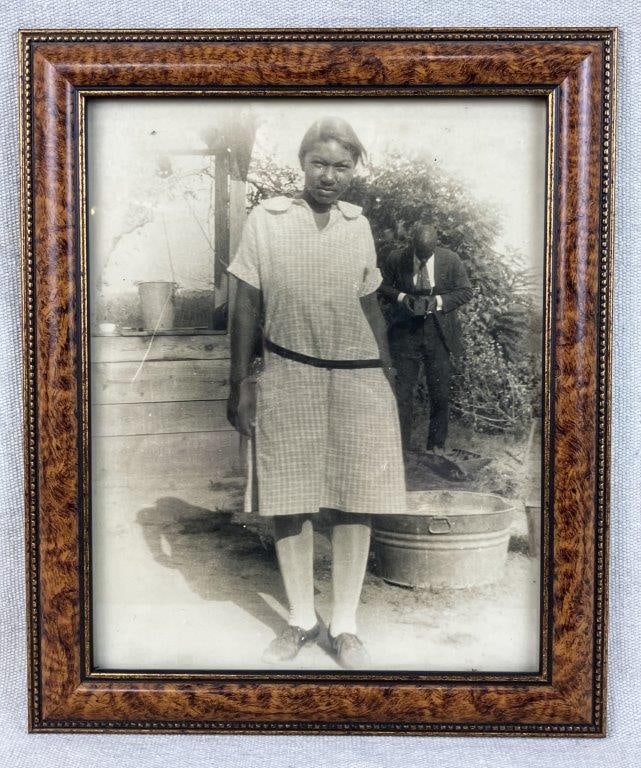 Francis Cooper Portrait Black Americana Photograph, 1920s: 1928 photograph of Francis Cooper, depicting a young African American woman with a nearby figure holding a camera, reflecting genre and documentary elements of the period. Housed in a frame measuring