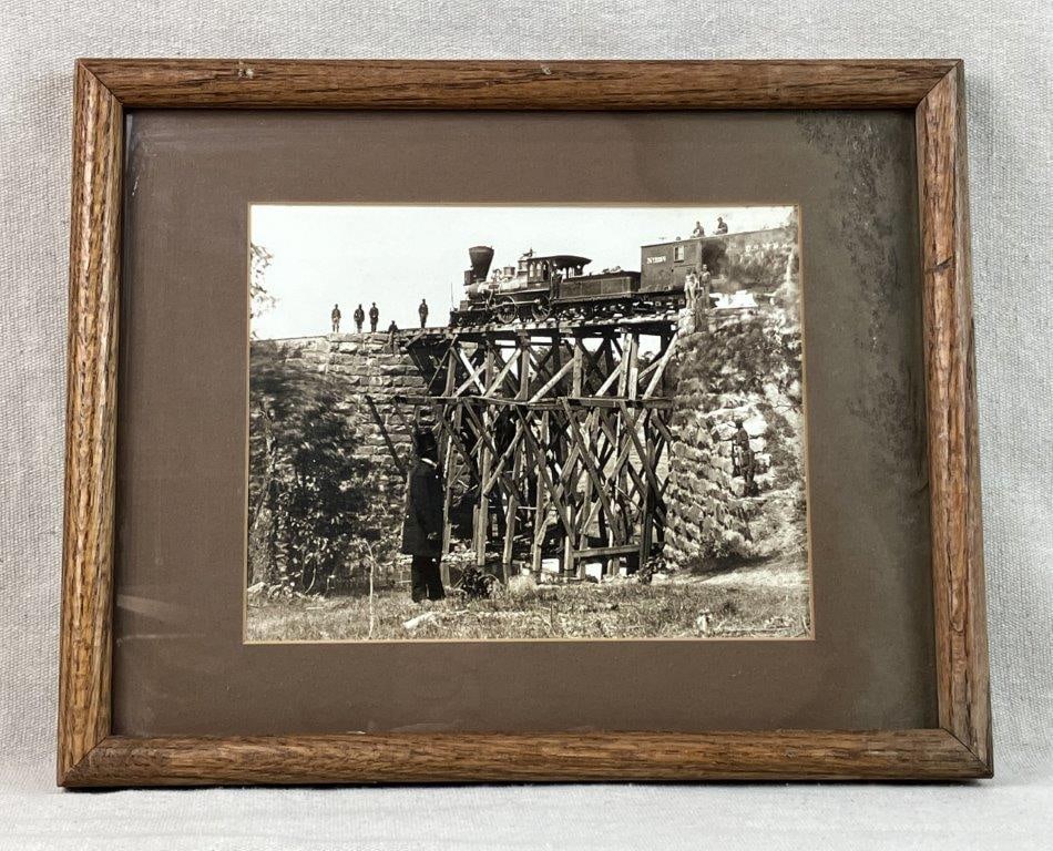 Civil War Train General Haupt Photograph: Photographic reproduction (1981, copyright to reverse) depicting Herman Haupt, a noted Civil War railway engineer, shown with a railroad train in a landscape setting. Haupt served as a prominent