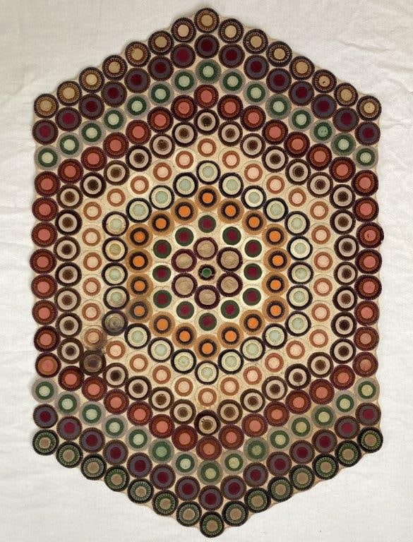 Penny Rug: Penny rug with a hexagonal design, constructed of felted circles in a traditional hand-worked format, offering strong visual texture and folk art character. Measures approximately