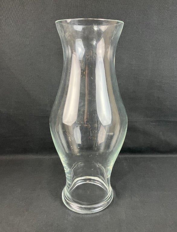 Glass Hurricane: Clear glass hurricane in a traditional form, suitable for candle display. Measures approximately 18 3/8â€³ H x 6 1/2â€³ in diameter. Good condition.