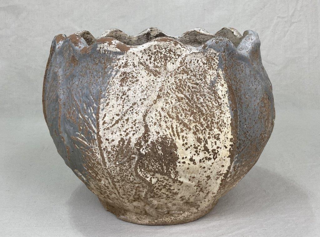 Terracotta Pot: Terracotta planter with a finished surface, suitable for plant display, featuring a classic rounded form. Measures approximately 13 1/4â€³ H x 15 1/2â€³ in diameter.