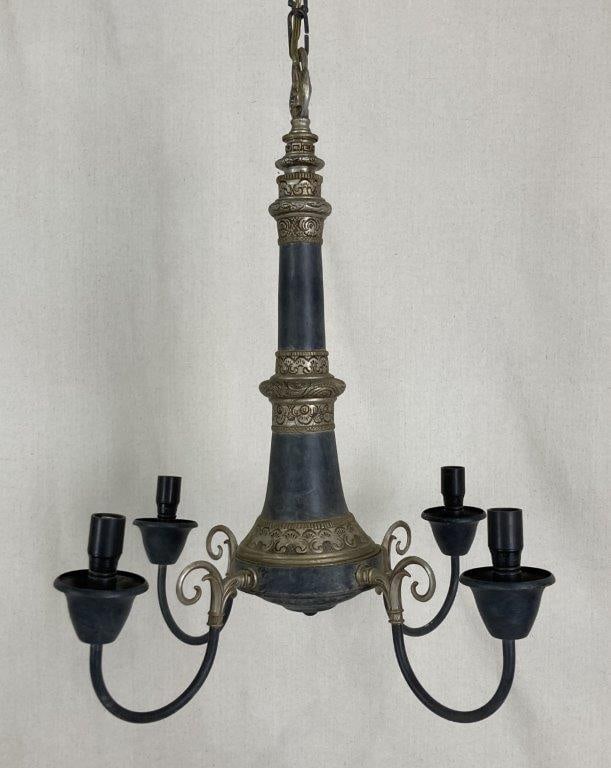 French Empire Style Chandelier: Chandelier with decorative silvertone elements and metal scrollwork arms, forming an ornate, multi-arm design.Wonderful piece in the style of the French Empire. Measures approximately