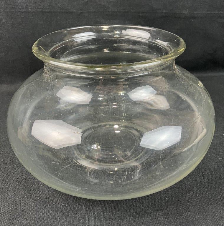 Pressed Glass Fish Bowl: Fishbowl with rounded form in pressed glass, displaying a simple utilitarian design. Measures approximately 7 3/4â€³ H x 10â€³ in diameter. Some surface wear.