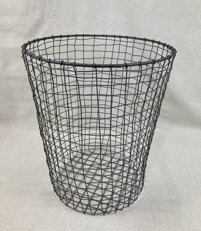 Wire Wastebasket: Open wire construction wastebasket with simple utilitarian form. Measures approximately 14 1/8â€³ H x 11 7/8â€³ in diameter. General wear.