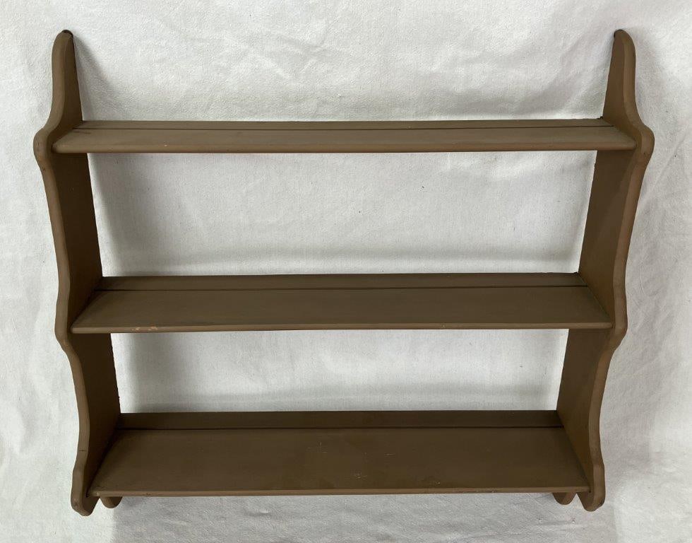 Painted Country Wall Shelf: Country wall shelf with a rich brown painted finish, featuring three shelves in a gently curving form, presenting a classic rustic profile. Measures approximately 29 3/4â€³ H x