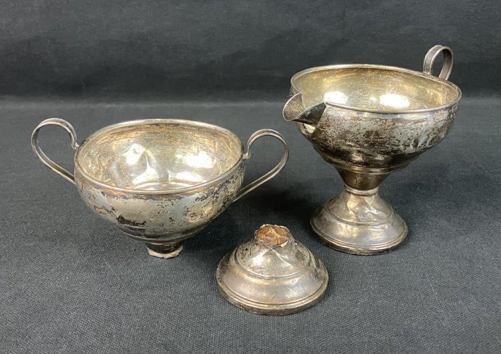 Sterling Silver Sugar and Creamer: Pair of weighted sterling silver hollowware, 19th century, including a creamer and a sugar (or waste) in elegant period forms. The creamer measures approximately 4â€³ H x 4