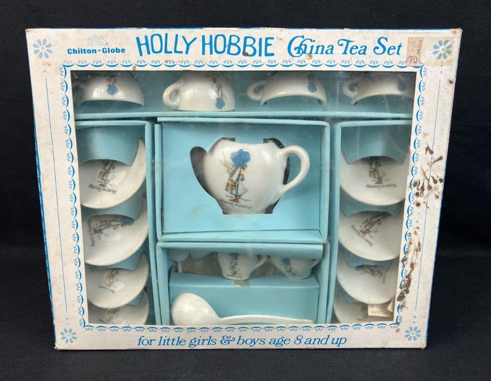 Childrenâ€™s Holly Hobbie China Tea Set: Childrenâ€™s china tea set featuring Holly Hobbie, retaining the original box. The box measures approximately 9 3/8â€³ H x 11 1/2â€³ W x 2