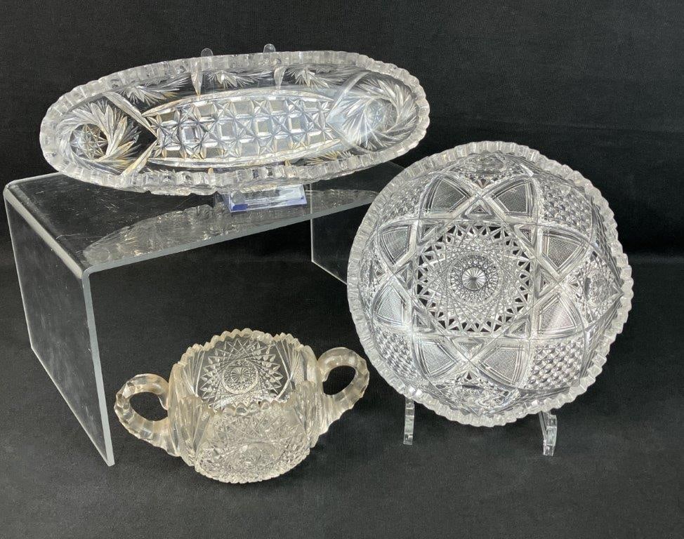 Brilliant Cut Glass Assortment: Group of three cut glass bowls featuring prismatic cutting and classic Brilliant Period styling. One measures approximately 3 3/8â€³ H x 8 1/8â€³ in diameter. Some abra