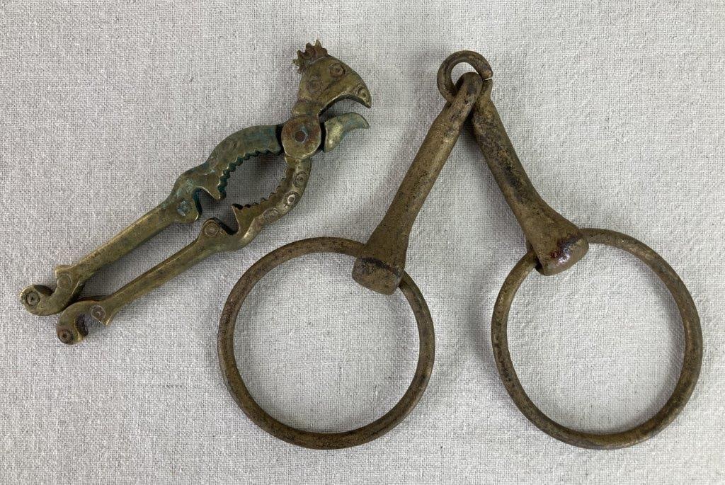 Brass Rooster Nutcracker and Snaffle Bit: This duo of solid brass curiosities brings together farmhouse charm and equestrian tradition, featuring a nutcracker stylized as a rooster alongside a horse harness snaffle bit. The nutcracker