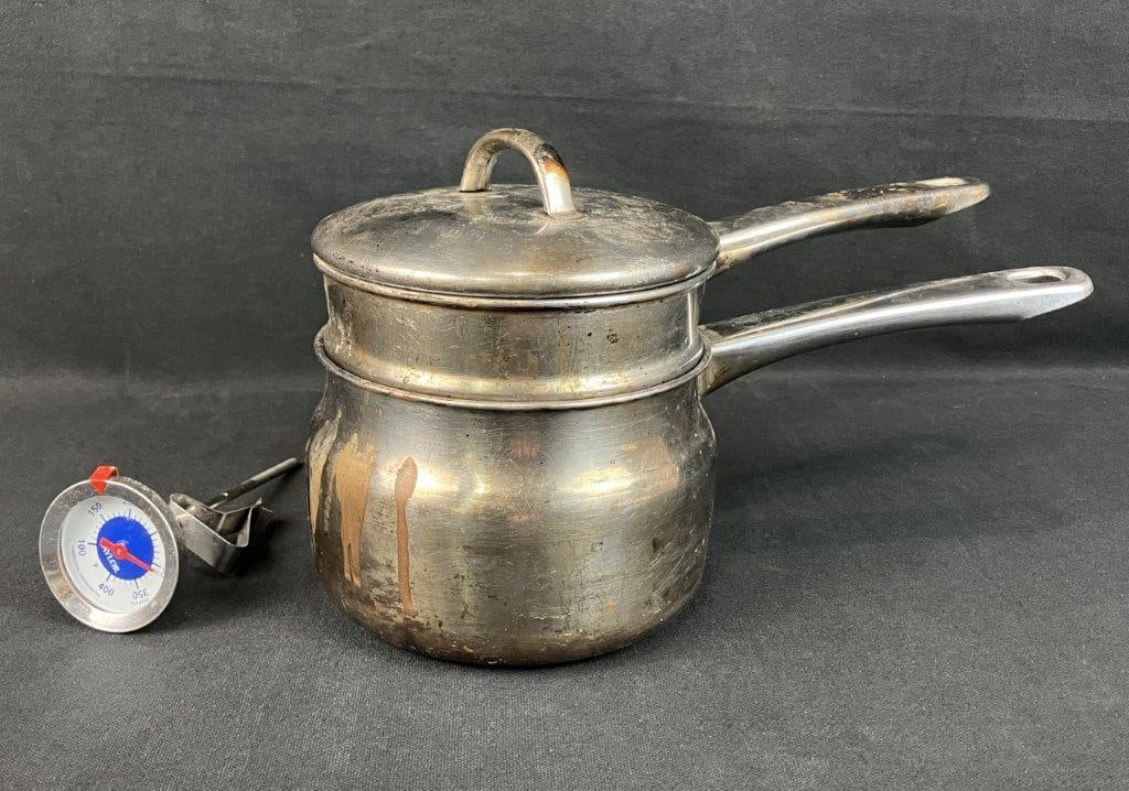 Double Broiler: Stainless steel cooking utensil comprising a double broiler or confection pot set, designed for controlled heating. Measures approximately 7â€³ H x 11â€³ W x