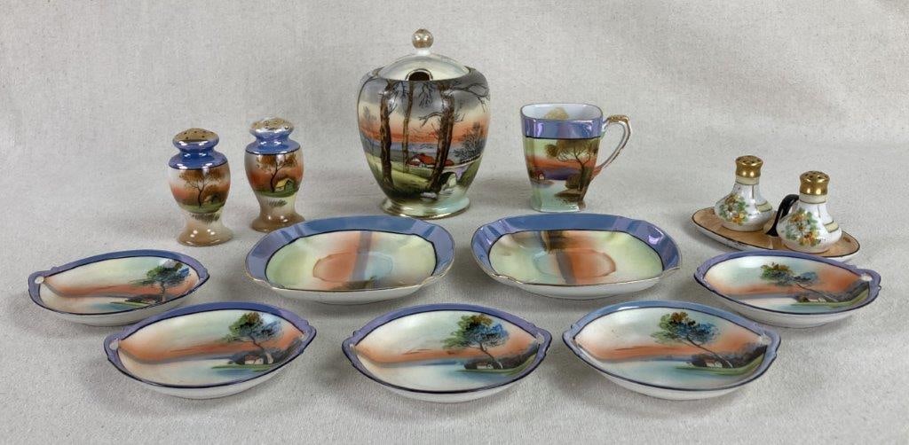 Noritake China Lot: A delicate and diverse assembly of vintage porcelain, this lot showcases the artistry of hand-painted Noritake craftsmanship through a recurring serene landscape motif and vibrant floral accents. The 