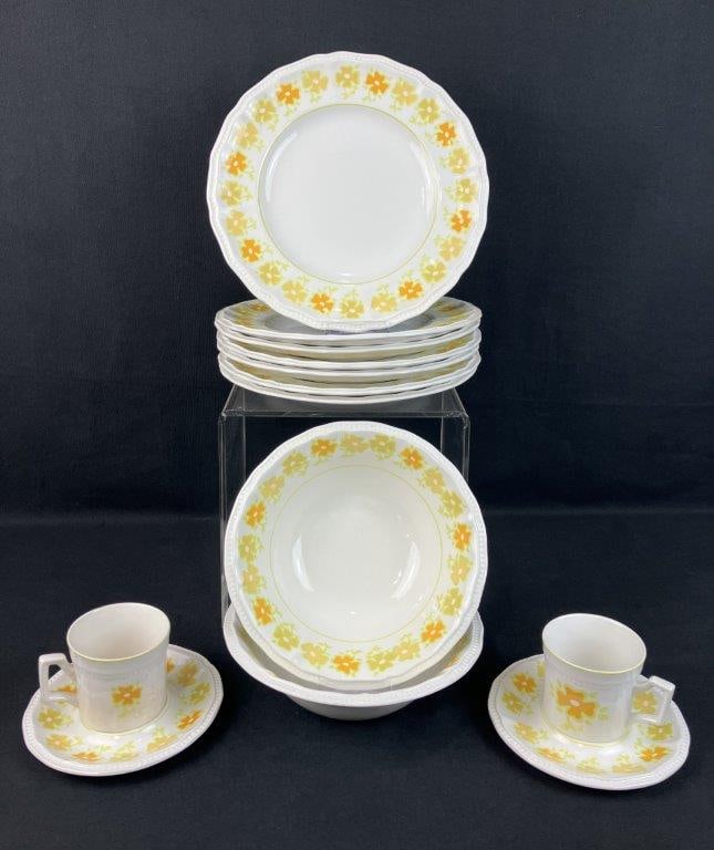 Kensington Staffordshire Ironstone China: Group of thirteen ironstone pieces by Kensington Staffordshire, decorated in the Piccadilly pattern with yellow floral motifs, including two teacups, two saucers, two bowls, seven dinner plates. The p