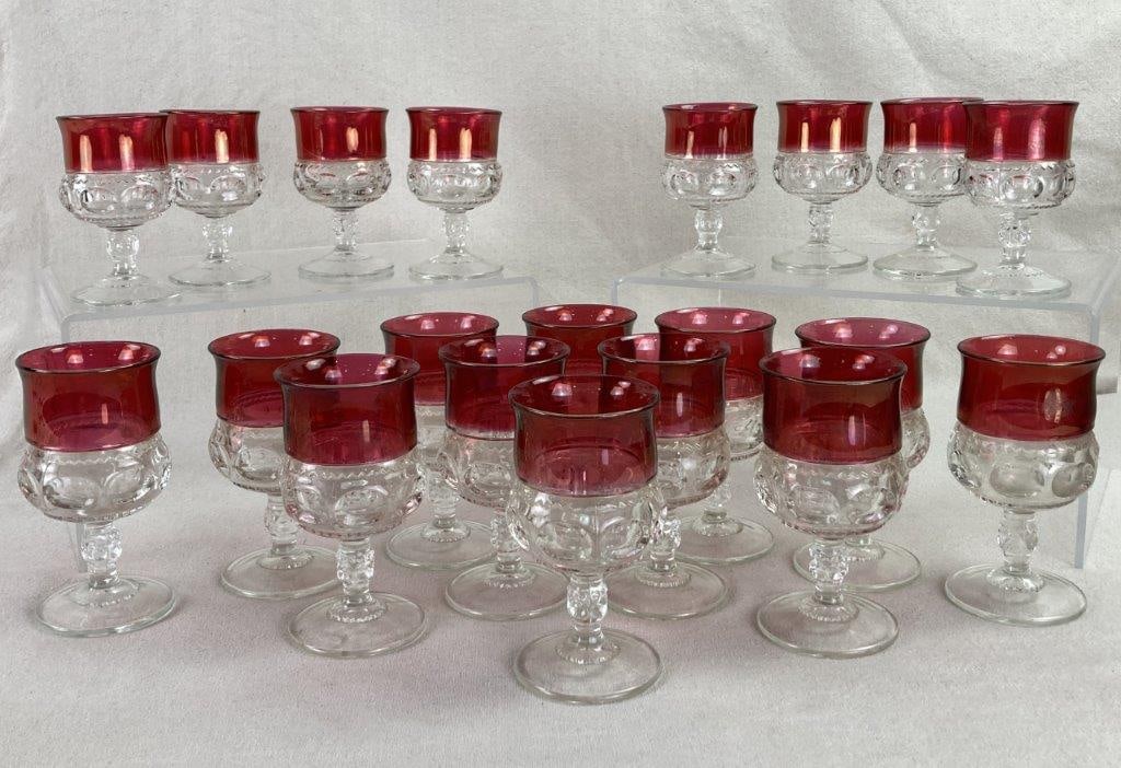 Red King's Crown Glasses: This substantial 20-piece assembly of stemware features the iconic Kingâ€™s Crown thumbprint pattern accented by vibrant ruby red rims. The collection is composed of twelve taller