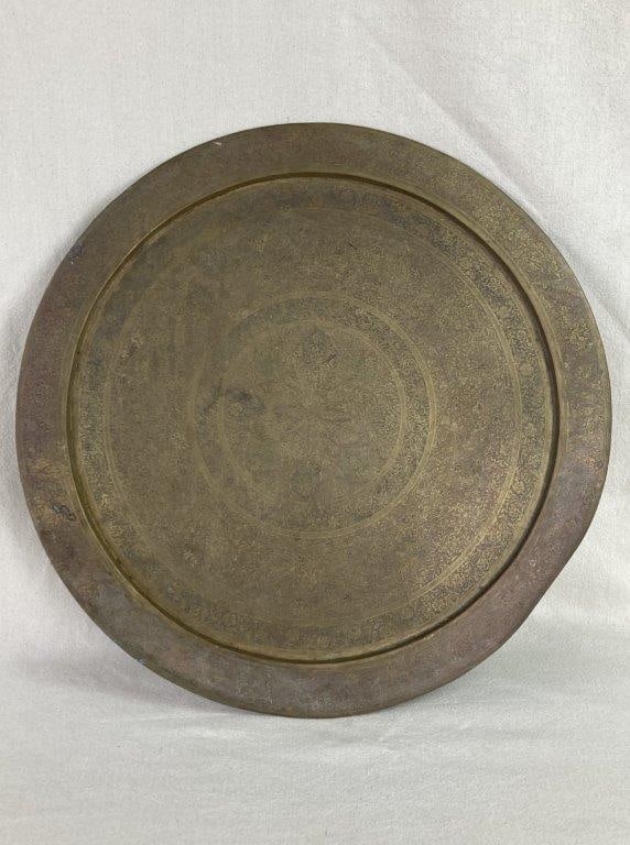 Mid-Century Modern Etched Wall Tray: This substantial solid brass wall tray is a classic example of Mid-Century Modern global decor, featuring an intricately etched design of swirling floral and foliage patterns radiating from a