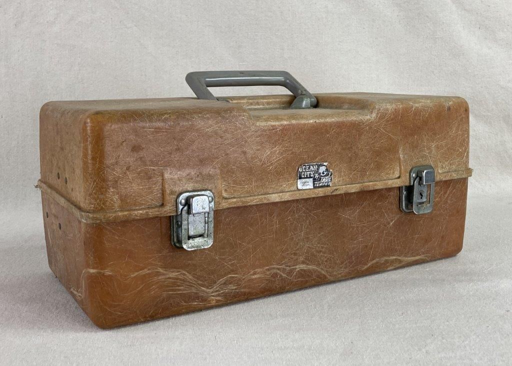 Ocean City Tackle Box with Supplies: A functional piece of mid-century sporting history, this Ocean City True Temper tackle box features a durable brown fiberglass body, a material innovation popularized in the 1950s and 60s for its