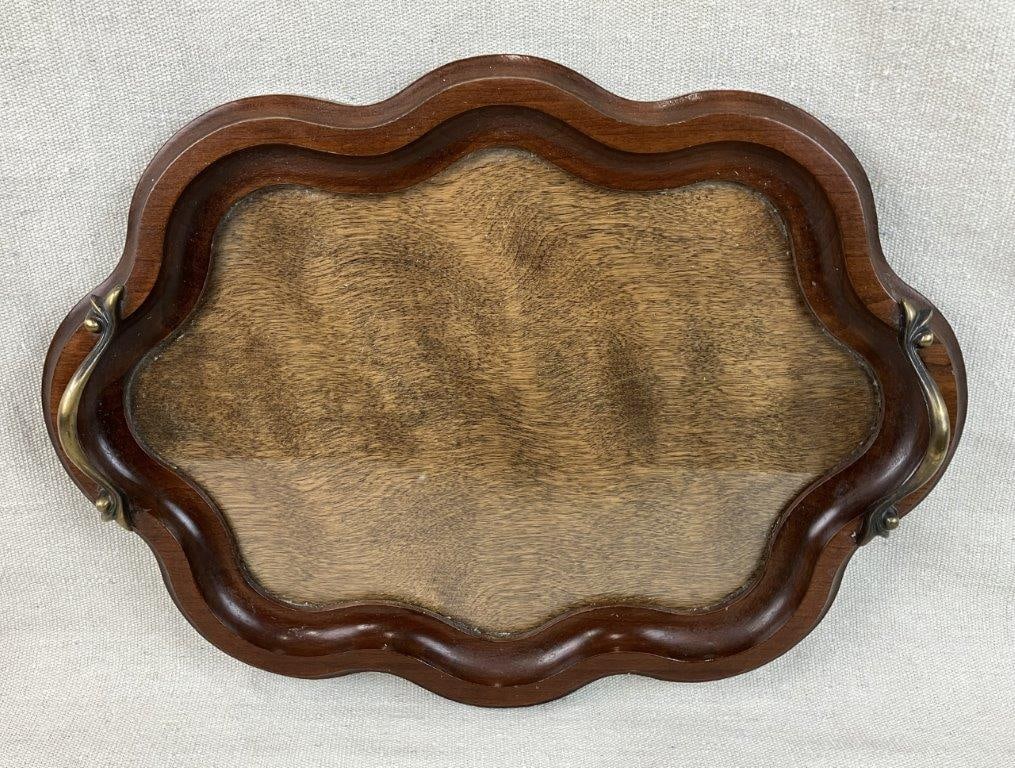 Dark Walnut and Glass Display Tray: Walnut serving tray with inset glass panel allowing for display of an image beneath, featuring a gently curving form and brass handles. Measures approximately 15â€³ H x