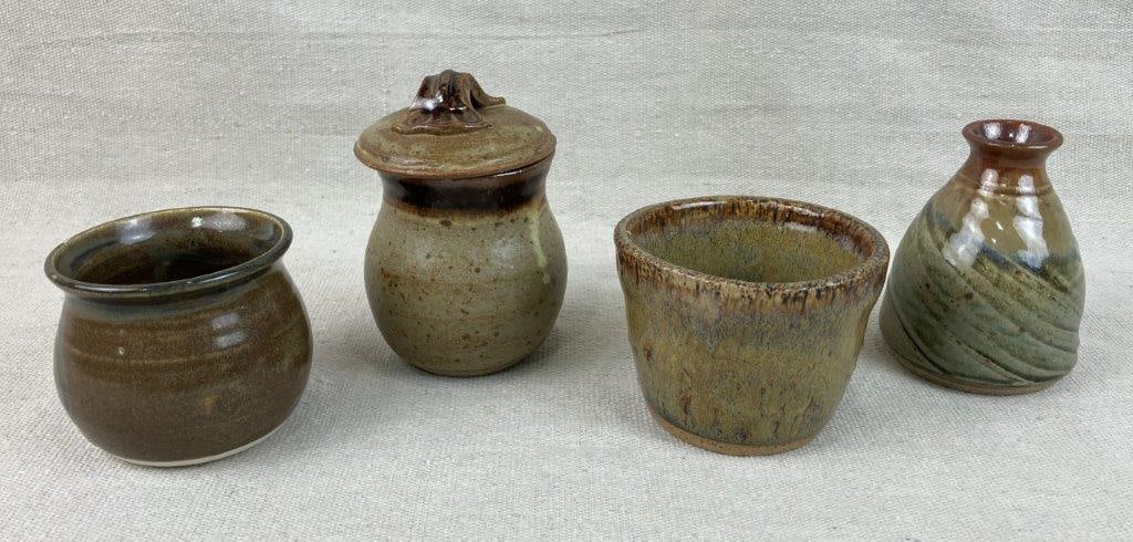Studio Pottery Assortment: Group of four studio pottery pieces, some signed, featuring speckled earth-tone glazes. The covered jar measures approximately 4â€³ H x 2 5/8â€³ in diameter. Good