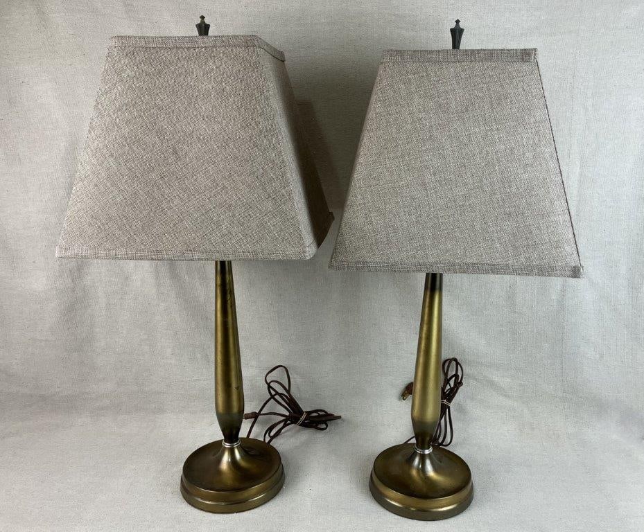 MCM Style Brass Lamps: Pair of Mid-Century Modern style brass lamps with linen shades, displaying warm metallic tones and classic proportions. One measures approximately 27 1/2â€³ H x 12â€³