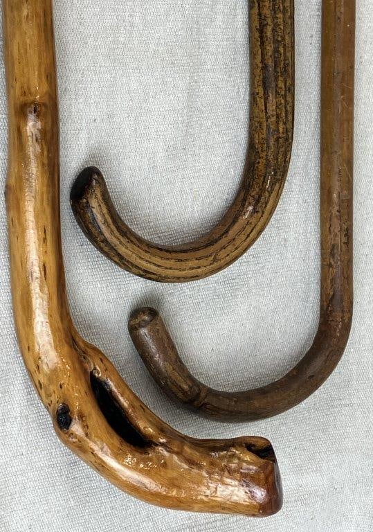 Three Carved Canes: Group of three canes exhibiting hand-carved folk art craftsmanship, each with unique character and form. The tallest measures approximately 37â€³ H x 1â€³ in diameter.