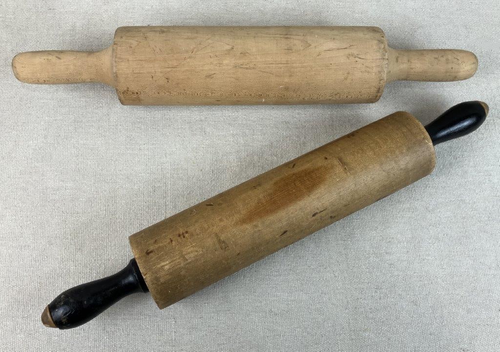 Pair of Wood Rolling Pins: Two wooden rolling pins in a country aesthetic, displaying warm patina and utilitarian form. The largest measures approximately 17 3/8â€³ H x 2 3/4â€³ in diameter.