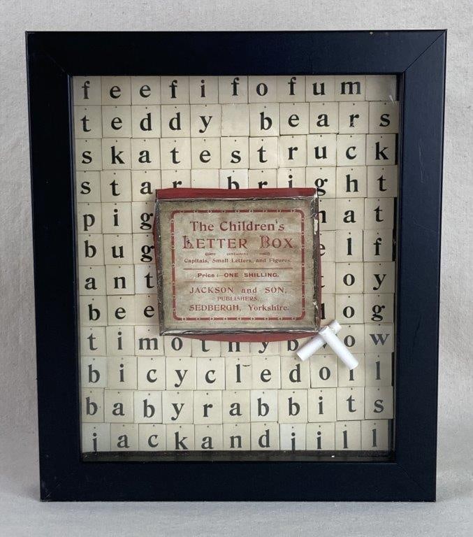 Children's Letterbox Art: This whimsical framed spelling display captures the nostalgic charm of early educational play, featuring a creative mock-up of a Childrenâ€™s Letterbox game. The interior is layered