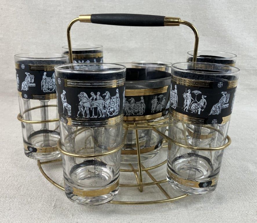 Mid Century Modern Greek Revival Drinkware Set: Drinkware set with Greek Revival styling, including a gold tone carrying caddy and coordinating glasses decorated with classical motifs, featuring black grounds with white figural scenes and rich