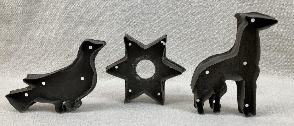 Three Early Cookie Cutters: Group of three tin cookie cutters in assorted forms, including a star, horse, and bird. The star measures approximately 3/4â€³ H x 4 3/8â€³ in diameter. General wear