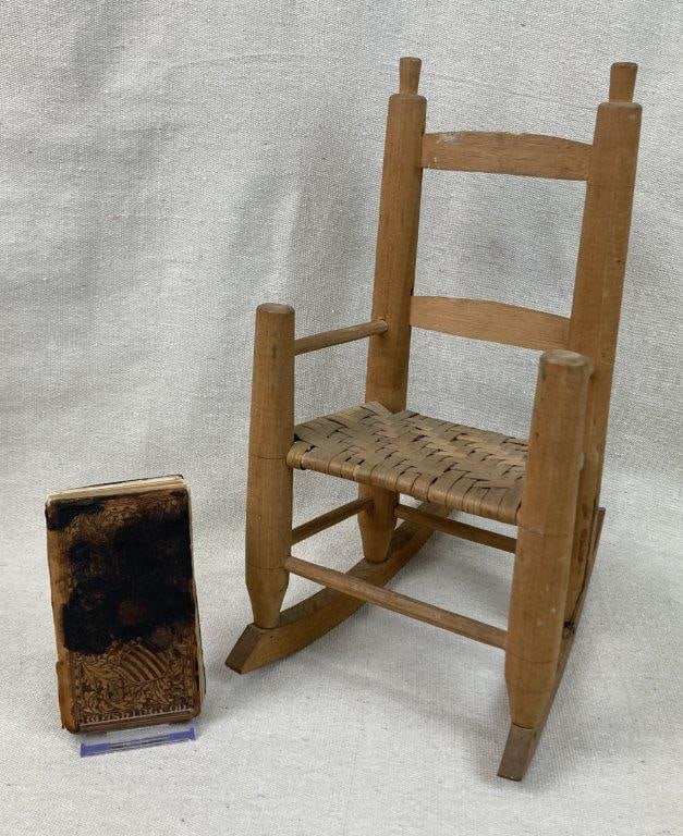 Miniature Rocking Chair and George Washington Tooled Leather Book: Grouping including a tooled leather book featuring patriotic decoration related to George Washington, accompanied by a complementary miniature country rocking chair with distinctive finials, woven