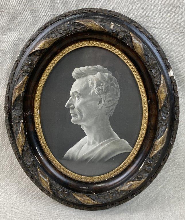 President Abraham Lincoln Print in Antique Frame: Print depicting Abraham Lincoln, presented in an oval antique frame with gilt decoration and three-dimensional floral designs. Frame measures approximately 14â€³ H x