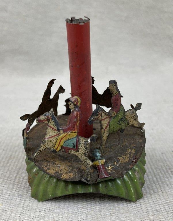 Tin Lithograph Carousel Toy: Small tin lithograph candle carousel, a classic novelty form, marked â€œGes. Gesch.â€ on the base indicating German origin. Measures approximately