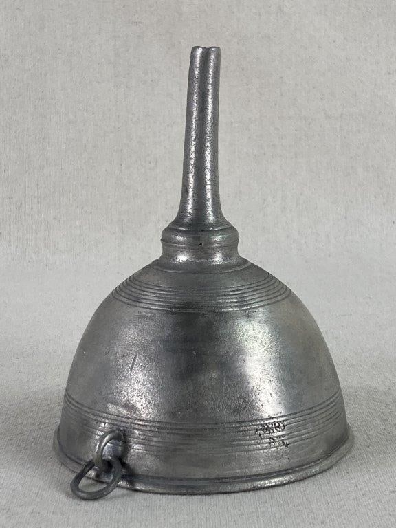 19th Century Pewter Funnel: A historic silver-tone pewter funnel featuring a classic conical body accented by fine engraved decorative rings. This utilitarian piece showcases the understated craftsmanship of 19th-century