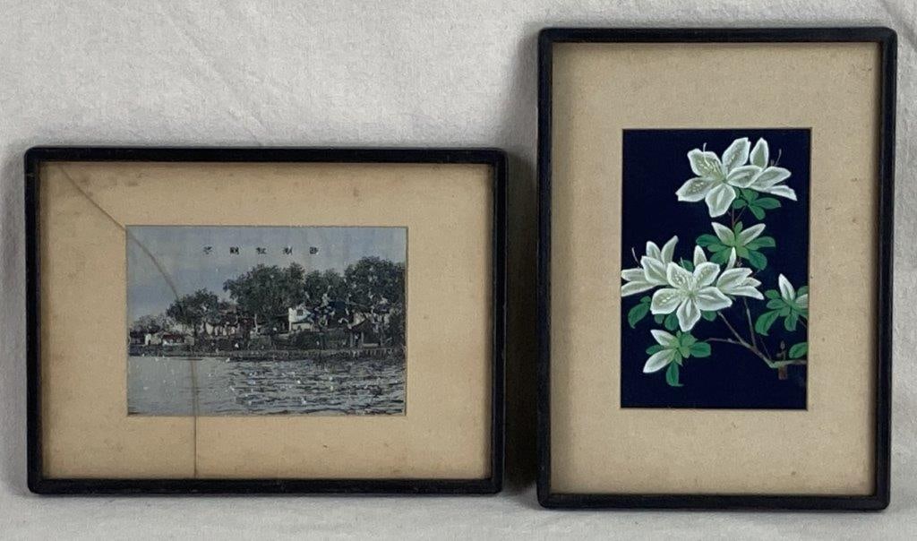East Asian Framed Art: This elegant pairing brings together two distinct East Asian artistic traditions. The Chinese landscape scene is rendered on fabric, depicting traditional buildings nestled among trees beside a body