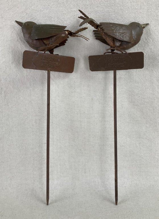 Metal Bird Garden Stake: This pair of tin garden stakes serves as a charming nod to horticultural history, featuring the name of the iconic rose and nursery brand, Jackson & Perkins, on rectangular plaques. Each stake is
