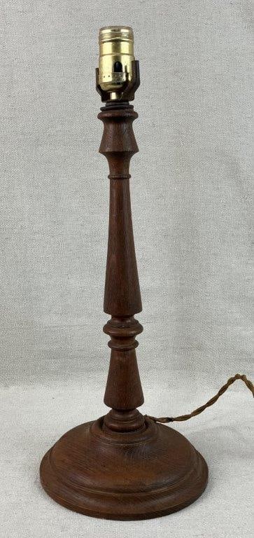Turned Oak Lamp: Lamp with turned oak construction and rustic character, displaying a rich, deep patina indicative of age. Measures approximately 17 3/8â€³ H x 6 1/4â€³ in diameter. Unt