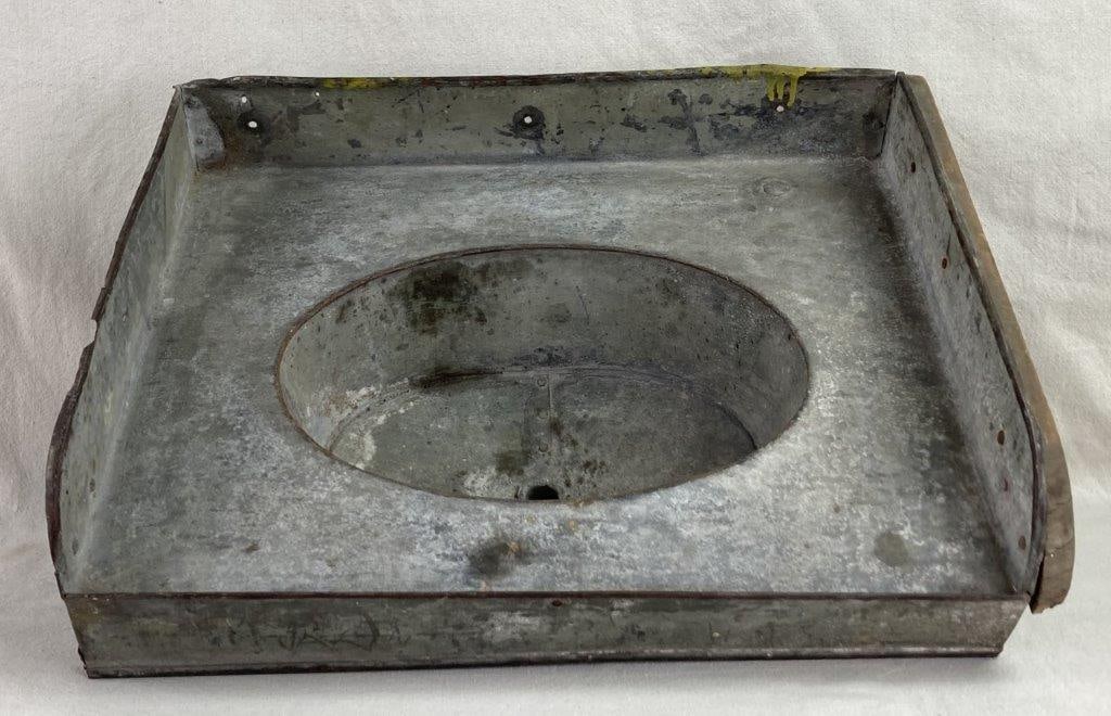 Country Tin Sink: This galvanized metal sink is a quintessential piece of rustic Americana, featuring a rectangular form and a deep basin designed for heavy-duty utility. Its rugged character is highlighted by a wood
