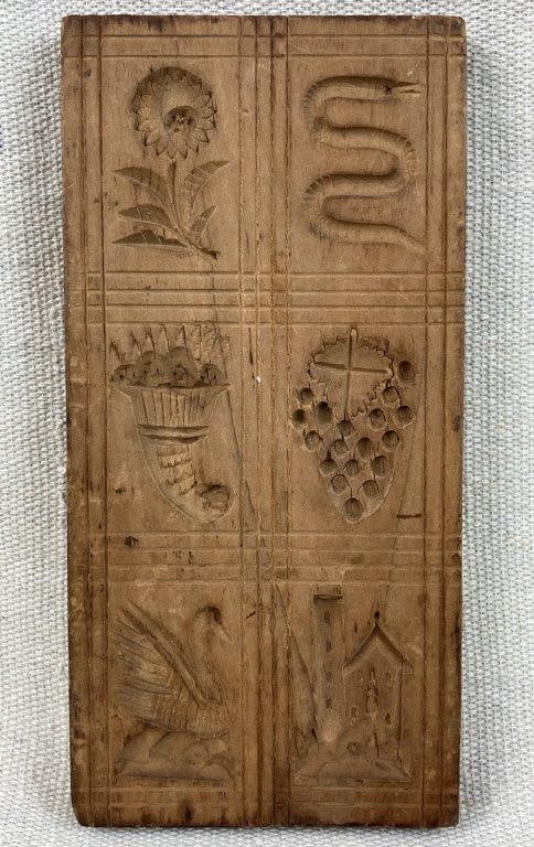 Primitive Cookie Mold: Carved wooden cookie mold with rich patina, featuring multiple forms including a swan, snake, flower, and additional motifs. Measures approximately 6 1/4â€³ H x 3
