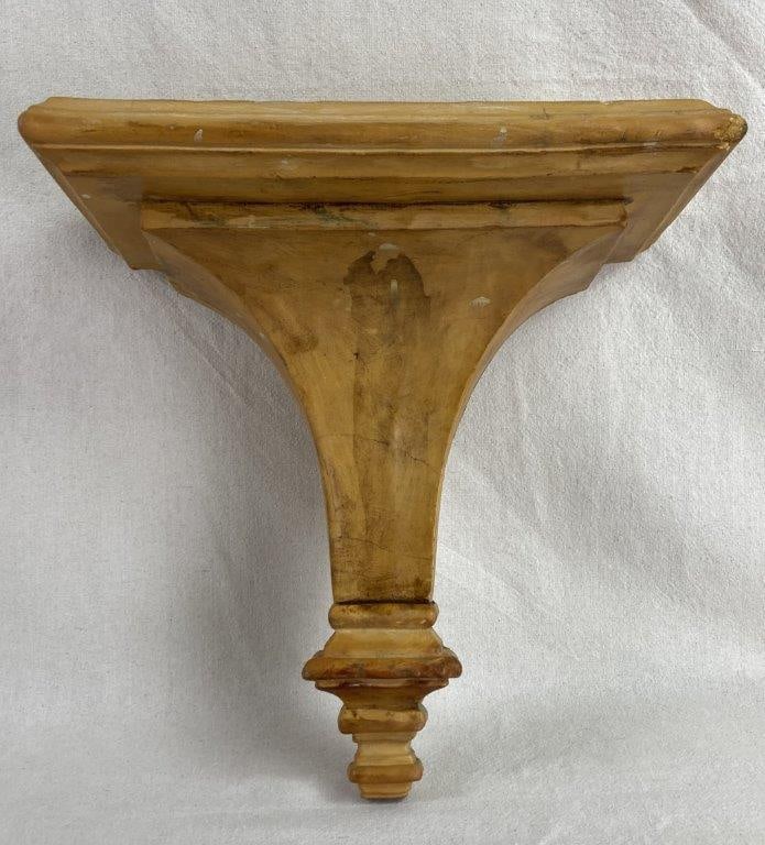 Hollywood Regency Wall Sconce Shelf: This Hollywood Regency-style wall sconce shelf brings a splash of mid-century glamour to any wall, finished in a distinctive and cheerful warm yellow paint. The design features a sweeping curved stem