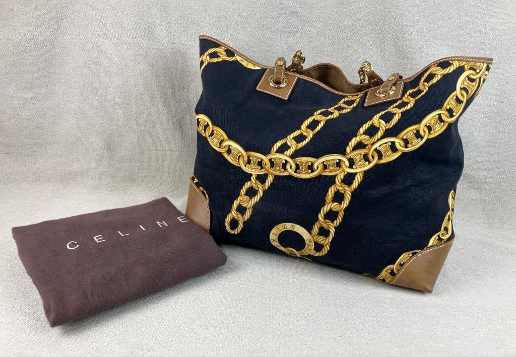 Celine Blason Chain Tote Bag: This Celine canvas tote features the iconic Blason/Triomphe motif seamlessly integrated into a gold chain link print against a navy canvas background. The design is accented with gold-tone branded