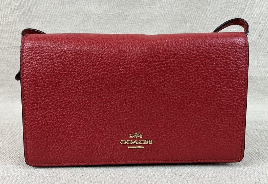 Coach Red Leather Crossbody Bag: This Coach crossbody bag is crafted from vibrant red pebble leather and features a versatile foldover clutch design with a removable strap. The exterior is accented with a gold-tone Coach logo, while