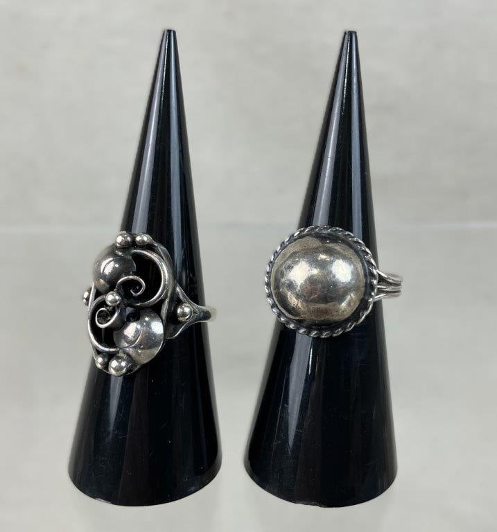 Artisan Sterling Silver Rings: Two artisan sterling silver rings showcasing unique artistic craftsmanship, with both pieces being unmarked but fully tested for silver content. The first ring features a central round silver componen