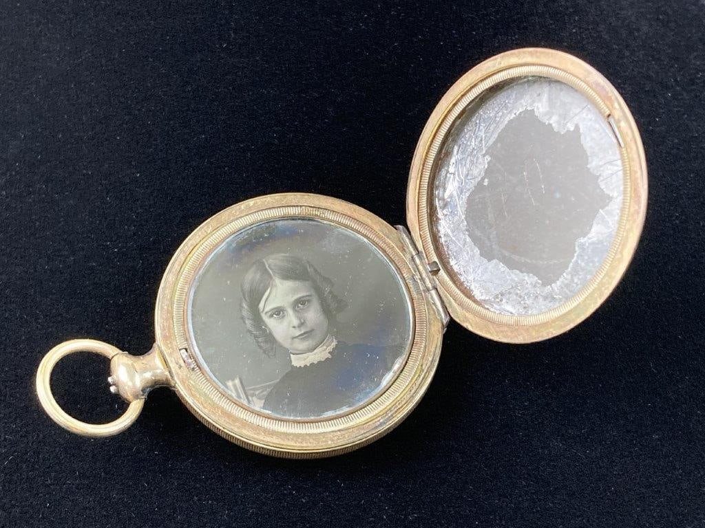 19th Century Ambrotype Locket: Converted pocket watch case locket opening to two compartments and containing three period ambrotype photographs, likely depicting family members, possibly a father, grandmother, and daughter,
