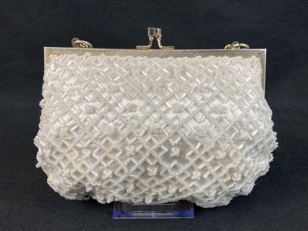 Vintage Walborg Beaded Evening Bag: An elegant vintage evening bag by Walborg featuring a white satin body beautifully adorned with intricate white beadwork in a sophisticated criss-cross and floral patterning, completed by a secure kis