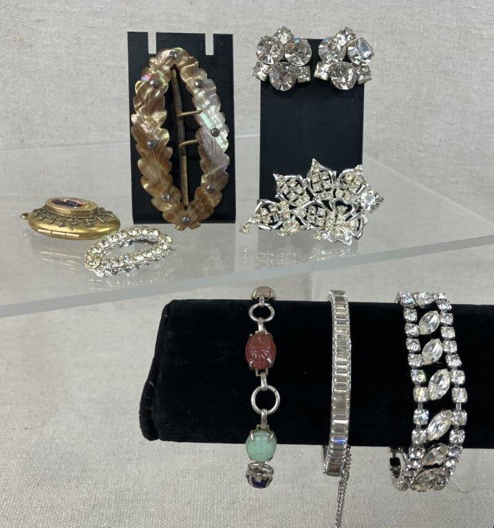 Vintage and Antique Jewelry Assortment: This eclectic assortment of eight vintage and antique jewelry pieces includes an Egyptian Revival scarab bracelet set with a variety of stones (tested for sterling silver), a gold-tone locket featurin