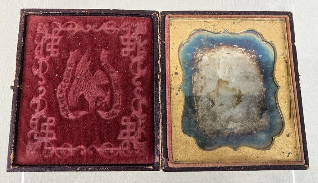 19th Century Daguerreotype Portrait, T.H. Newcomer: This 19th-century daguerreotype captures a seated woman housed in a classic brown leather case featuring a scrolling floral motif on the cover. The interior is lined with red velvet and showcases an