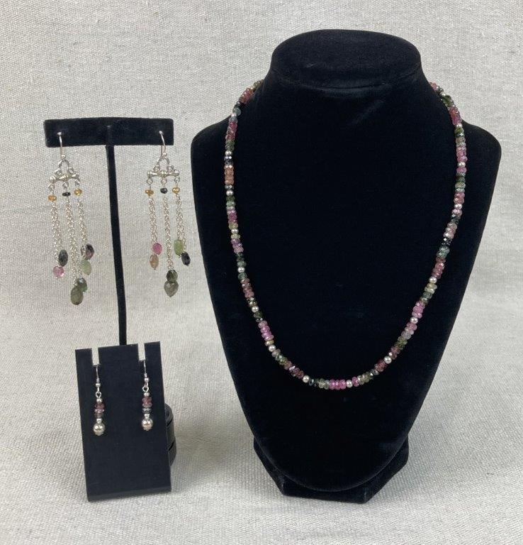 Sterling Silver Tourmaline Gemstone Earrings and Necklace: This three-piece collection of multi-colored tourmaline gemstone jewelry showcases rich, vibrant tones paired with classic silver work. The lot includes a pumpkin-cut tourmaline necklace finished